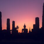 majestic sunset sky over big buddha statue